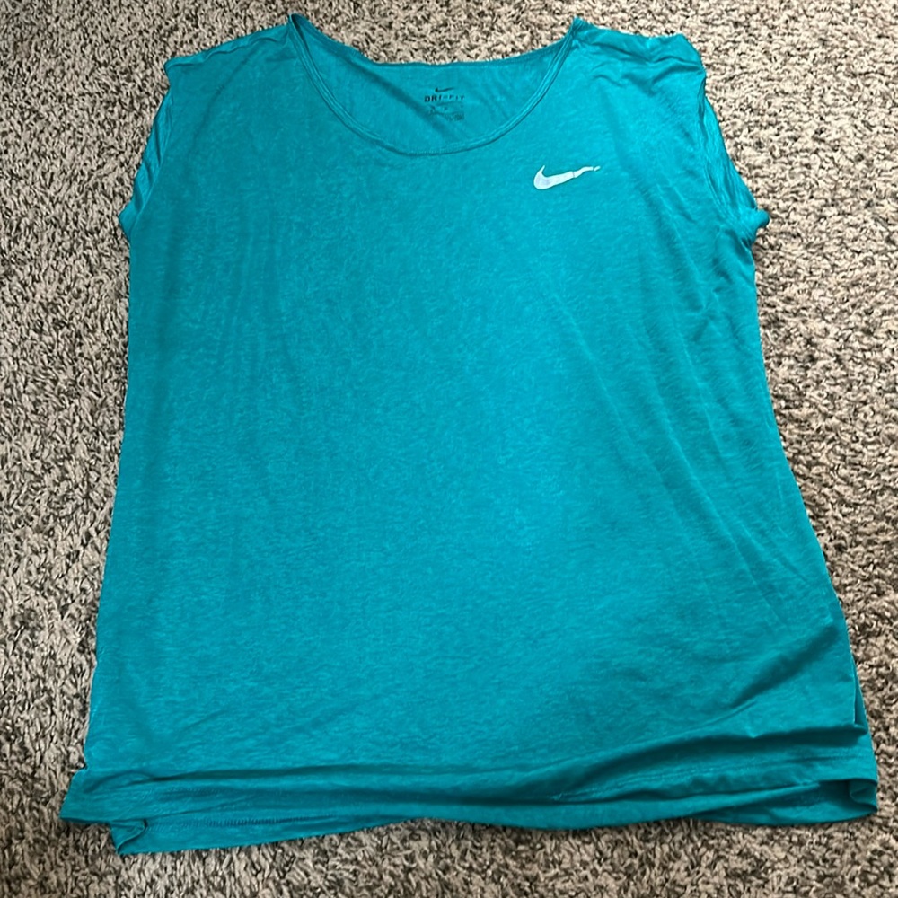 Sheer teal Nike running top. Size M.